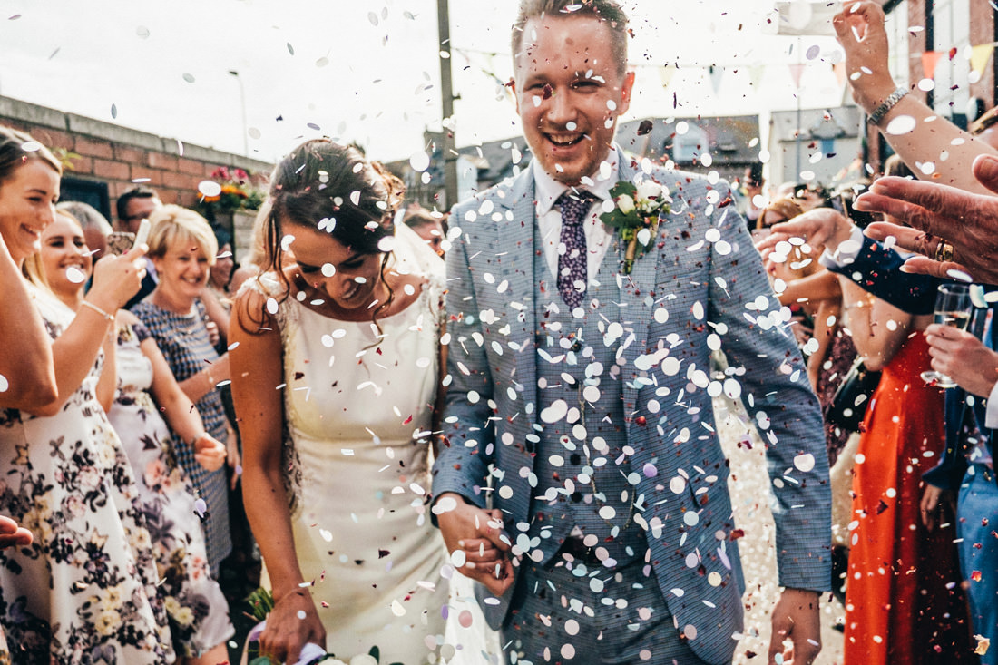 002 COLOURFUL CONFETTI SHOT BRIDE AND GROOM WEDDING RECEPTION TRAMSHED CARDIFF WEDDING PHOTOGRAPHY